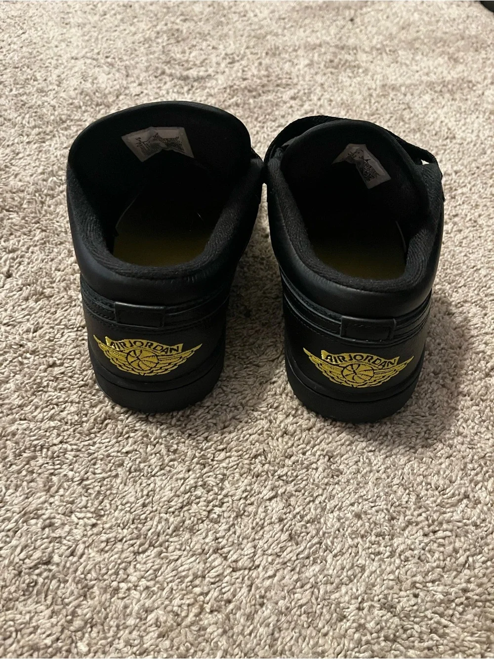 Jordan 1 Black Low-Top Sneakers with Yellow Accents